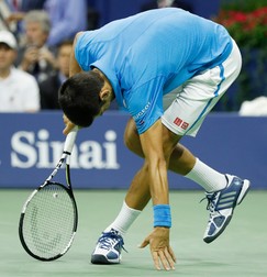 epa05535707 Novak Djokovic of Serbia reacts as he plays Stan Wawrinka of Switzerland during the men's final on the final day of the US Open Tennis Championships at the USTA National Tennis Center in Flushing Meadows, New York, USA, 11 September 2016. The US Open runs through September 11. EPA/JUSTIN LANE