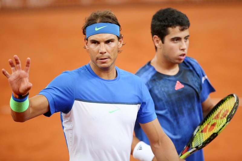 epa04863043 Rafael Nadal (L-R) and Jaume Munar, both of Spain, walk across the court during a doubles match against Bolelli and Fognini of Italy at the ATP tennis tournament in Hamburg, Germany, 27 July 2015. EPA/Bodo Marks