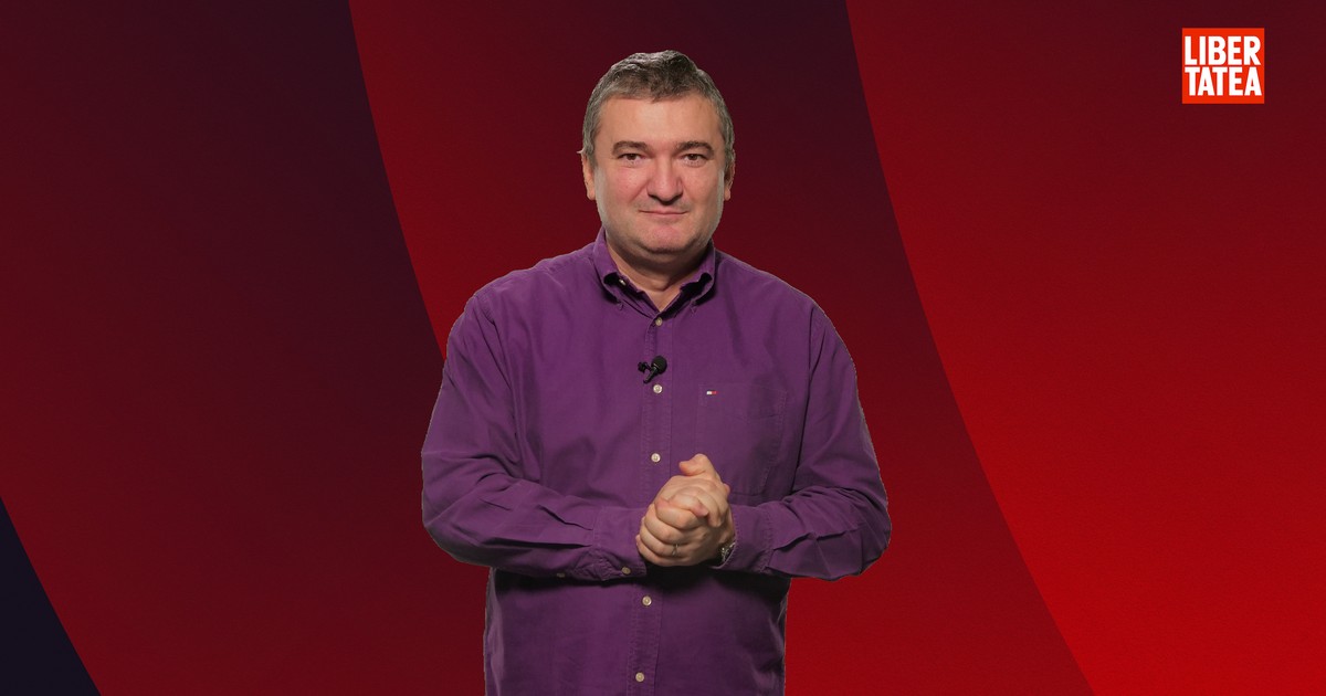 Dorin Chioțea, redactor-șef Libertatea.ro, îmbrăcat într-o cămașă mov, pe un fundal vișiniu.