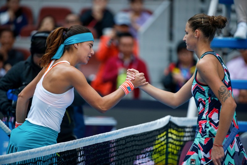 epa06245288 Sorana Cirstea (L) of Romania greets Karolina Pliskova of the Czech Republic at the net after defeating her in their women's singles third round match of the China Open tennis tournament at the National Tennis Center in Beijing, China, 05 October 2017. EPA-EFE/ROMAN PILIPEY