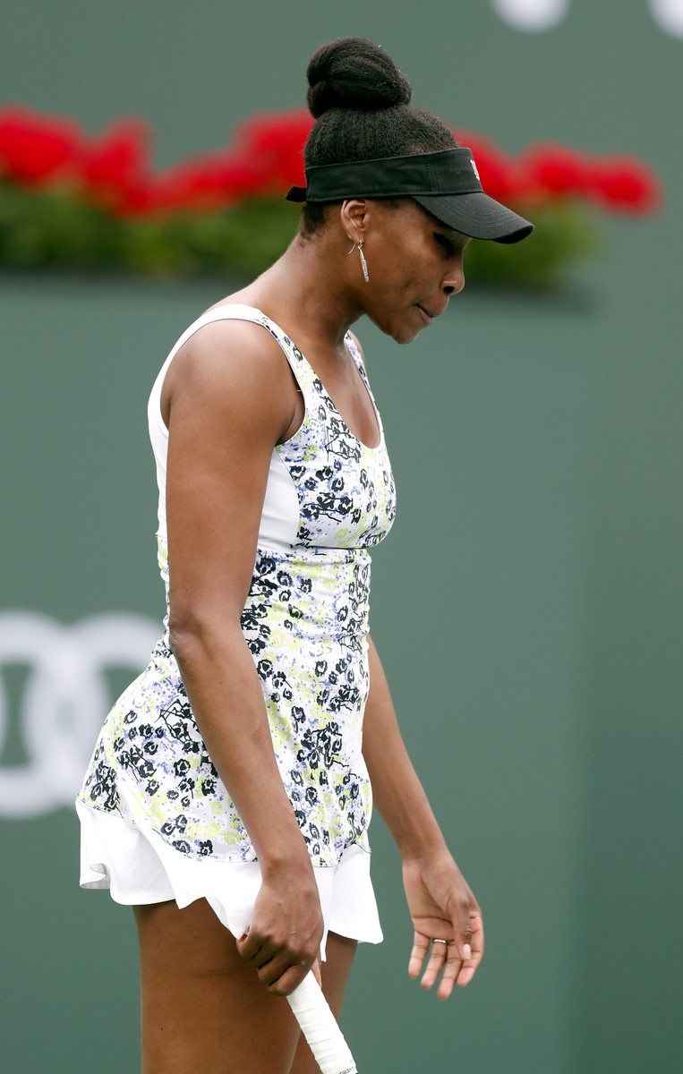 epa06594767 Venus Williams of the USA reacts in her match against Sorana Cirstea from Romania during the BNP Paribas Open at the Indian Wells Tennis Garden in Indian Wells, California, USA, 10 March 2018. EPA-EFE/MIKE NELSON
