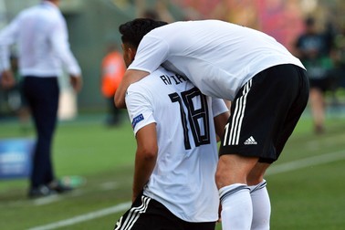 epa07677738 Germany's Nadiem Amiri (L) reacts after scoring the 1-0 lead during the UEFA European Under-21 Championship 2019 semi final soccer match between Germany and Romania in Bologna, Italy, 27 June 2019. EPA-EFE/RENATO OLIMPIO
