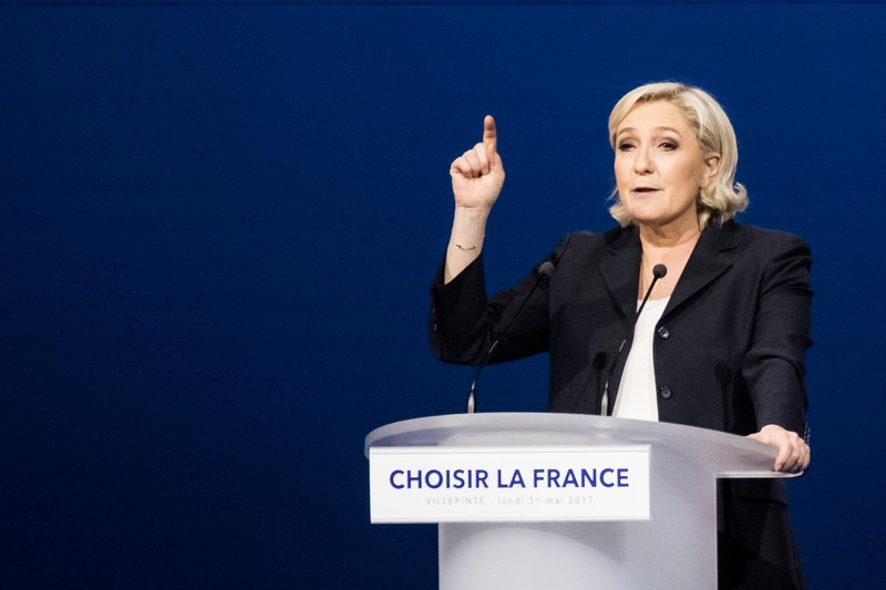 epa05938716 Far-right Front National (FN) party candidate Marine Le-Pen delivers a speech during a meeting in Villepinte, north of Paris, France, 01 May 2017. Far-right Front National (FN) party candidate Marine Le-Pen and 'En Marche!' (Onwards!) party candidate Emmanuel Macron arrived in the lead positions in the first round of the presidential elections. France will hold the second round on 07 May 2017. EPA/ETIENNE LAURENT
