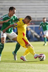 epa04797780 Romania's Gabriel Torje (R) vies with Northern Ireland Jonathan Evans during the UEFA EURO 2016 qualifying Group F soccer match between Northern Ireland and Romania at Windsor Park in Belfast, Northern Ireland, 13 June 2015. EPA/Paul McErlane
