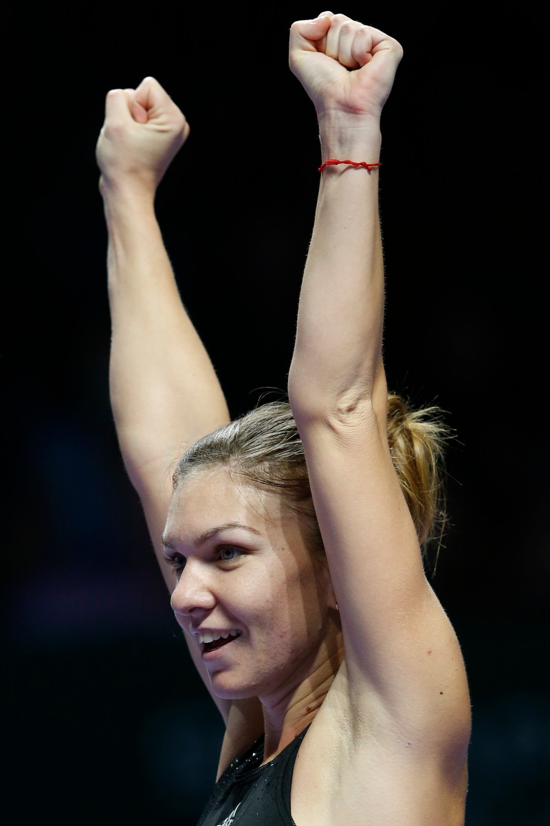 Simona Halep, fericită după ce s-a calificat în finala turneului de la Singapore FOTO: EPA