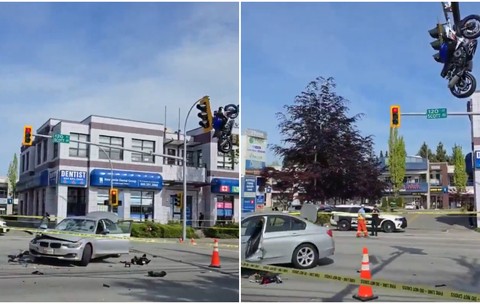 Momentul în care o motocicletă rămâne suspendată de un semafor, după ce s-a izbit de o mașină și a zburat pe deasupra ei, în Canada