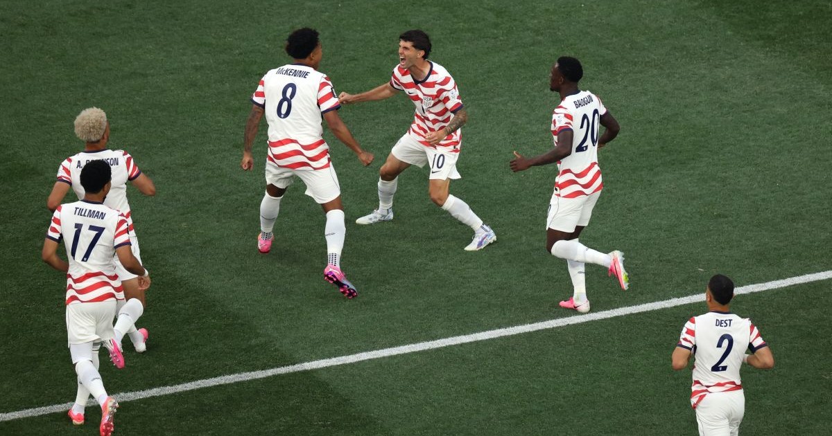 INGLEWOOD, CALIFORNIA - JUNE 12: Christian Pulisic #10 and Weston McKennie #8 of the United States celebrate their side's first goal, an own goal by Damian Bobadilla #16 of Paraguay (not pictured), during the FIFA World Cup 2026 Group D match between USA and Paraguay at Los Angeles Stadium on June 12, 2026 in Inglewood, California. (Photo by Harry How/Getty Images)