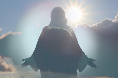 Silhouette of Jesus Christ and cloudy sky, double exposure