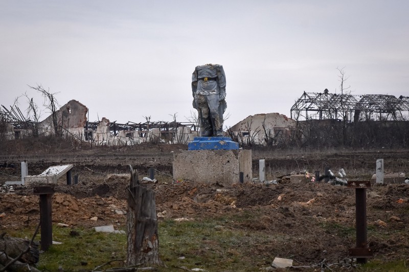 A destroyed monument to the WWII Unknown soldier stands headless in the central square in village of Robotyne, after heavy battle with Russian troops in Zaporizhzhia region, Ukraine, Friday, March 1, 2024. (AP Photo/Andriy Andriyenko)