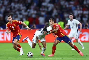Rodri of Spain fouls Jude Bellingham of England as Fabián Ruiz looks on Spain v England, UEFA European Championship 2024, Final, Football, Olympiastadion, Berlin, Germany, 14 Jul 2024,Image: 889702770, License: Rights-managed, Restrictions: EDITORIAL USE ONLY No use with unauthorised audio, video, data, fixture lists, club/league logos or "live" services. Online in-match use limited to 120 images, no video emulation. No use in betting, games or single club/league/player publications., Model Release: no