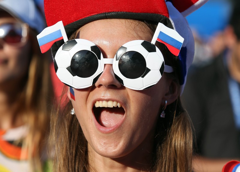 epa06807560 A Russia's fan cheer for her team during a live broadcast of the FIFA World Cup 2018 Group A preliminary round soccer match between Russia and Saudi Arabia in the fan zone in Sochi, Russia, 14 June 2018. The FIFA World Cup 2018 will take place in Russia from 14 June until 15 July 2018. EPA-EFE/MOHAMED MESSARA