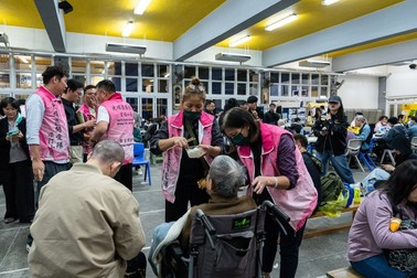 Residents rest at a temporary shelter after a fire broke out at Wang Fuk Court, a residential estate in the Tai Po district of Hong Kong's New Territories, Wednesday, Nov. 26 2025.,Image: 1054753236, License: Rights-managed, Restrictions: This content is intended for editorial use only. For other uses, additional clearances may be required., Model Release: no