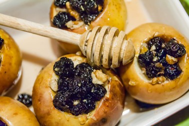 60572913 - baked apples with dried fruit and honey.