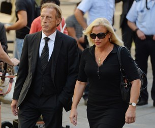 epa04900085 German soccer coach Christoph Daum arrives with his wife Angelica to attend the funeral service of Gerhard Mayer-Vorfelder, former president of Stuttgart soccer club and president of the German Soccer Association (DFB), inside the Domkirch St. Eberhard in Stuttgart, Germany, 27 August 2015. Gerhard Mayer-Vorfelder died on 17 August aged 82. EPA/WOLFRAM KASTL