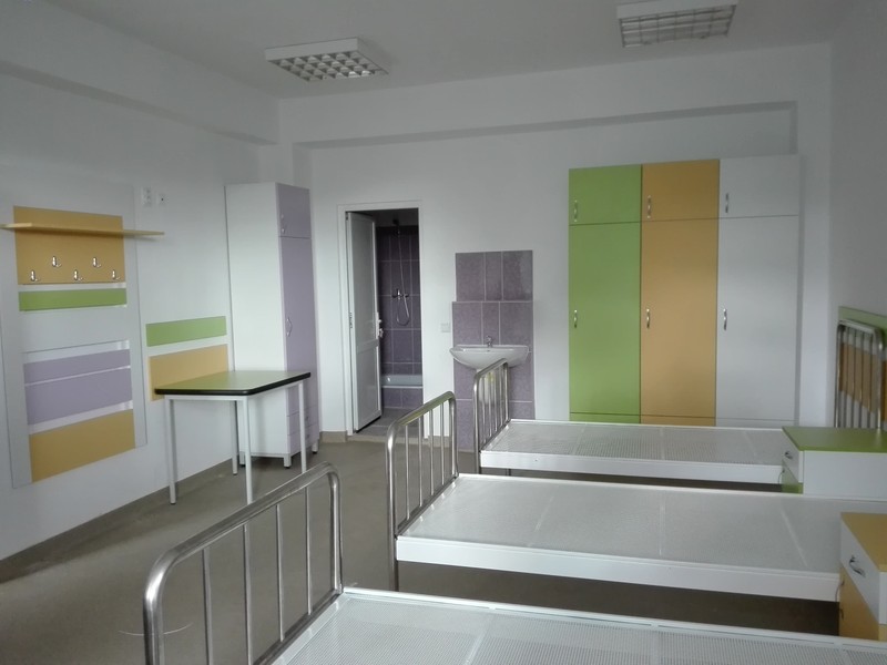 Imagine cu un salon din noua clădire aflată în construcție de cinci ani