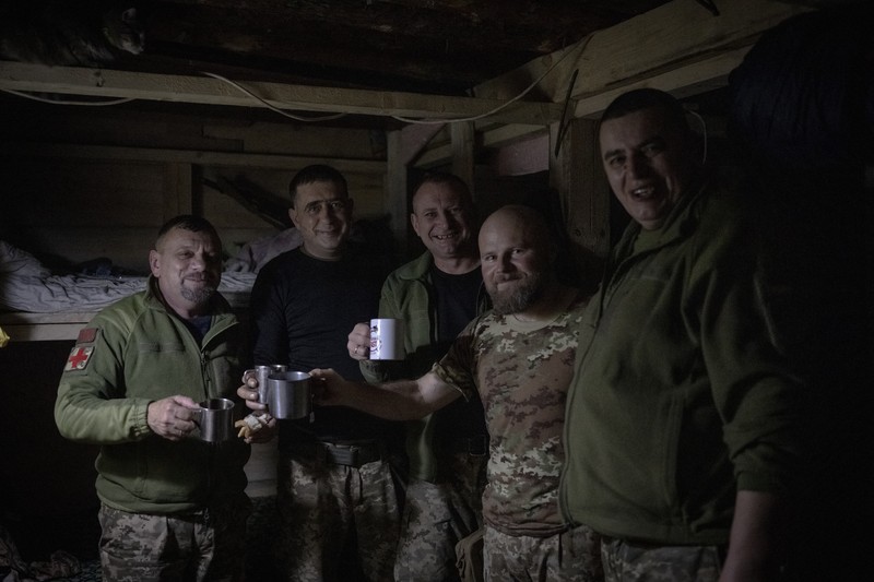 AVDIIVKA, UKRAINE - DECEMBER 31: Ukrainian military medical personnel spend time together at stabilization point as Russia-Ukrainian war continues on the New Year's Eve on frontlines in the direction of Avdiivka city, in Donetsk Oblast, Ukraine on December 31, 2023. On the last day of 2023, the tank units from the 59th mechanized brigade actively engaged in multiple rounds of shooting, targeting Russian positions amidst heavy fire. Ozge Elif Kizil / Anadolu,Image: 833552681, License: Rights-managed, Restrictions: , Model Release: no