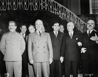 President Harry S.Truman and Joseph Stalin on the lawn outside of Soviet Union Prime Minister Stalin's residence during the Potsdam Conference in Potsdam, Germany. The group of men, L to R: Prime Minister Josef Stalin, Charles Bohlen, interpreter for President Truman, V. N. Pavlov, interpreter for Prime Minister Stalin, President Harry S. Truman, Andrei Gromyko, Soviet Ambassador to the United States, Charles Ross, U. S. Press Secretary, and Soviet foreign minister Vyacheslav Molotov., 07/18/1945