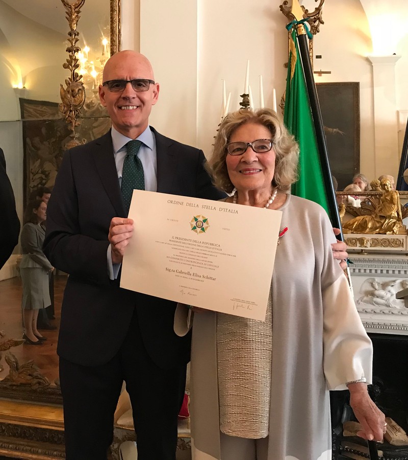 BNPS.co.uk (01202 558833)?Pic: MarkEzra/BNPS Gabriella Ezra being presented with her Star Of Italy by the Italian ambassador last year. Brighton nonagenarian Gabriella Ezra(91) has finally been recognised for her wartime heroics... The extraordinary story of how a teenage girl saved an entire village from being executed by the Nazis has come to light after she finally received a gallantry award nearly 74 years later. Fearless Gabriella Ezra, 91, who lives in Brighton, Sussex, intervened to stop her father Luigi and 37 other inhabitants of a rural village in her native Italy from being massacred by a firing squad during the chaotic last days of WW2. She has now been awarded an Italian Star of Italy medal after her son Mark wrote to the Italian embassy to make them aware of her remarkable actions on the morning April 28, 1945. Gabriella, who was 17 years old at the time, chased after a German officer and pleaded with him to show mercy to the villagers of Capella di Scorze, near Venice, who had been rounded up and locked in a cowshed. The Germans were after retribution following an attack on their men by Italian partisans which had left several of them wounded. ***EXCLUSIVE***