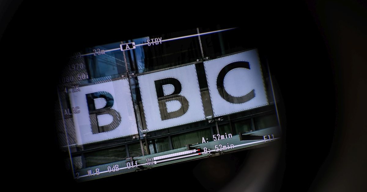 LONDON, ENGLAND - JULY 10: The logo on the front of BBC Broadcasting House is seen through a televison camera viewfinder on July 10, 2023 in London, England. Last week, the Sun newspaper published allegations that a BBC presenter had paid tens of thousands of pounds to a teenager in exchange for explicit photos. The broadcaster has said that a male presenter has been suspended while it conducts an investigation. (Photo by Leon Neal/Getty Images)