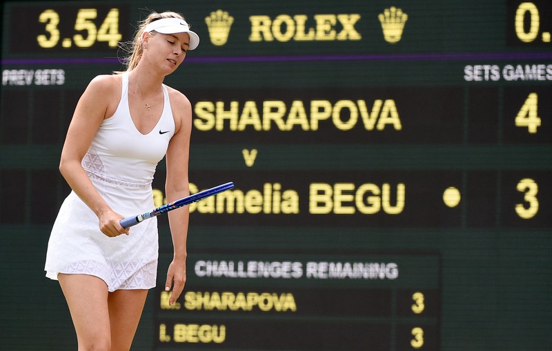 epa04829552 Maria Sharapova of Russia in action against Irina-Camelia Begu of Romania during their third round match for the Wimbledon Championships at the All England Lawn Tennis Club, in London, Britain, 03 July 2015. EPA/FACUNDO ARRIZABALAGA