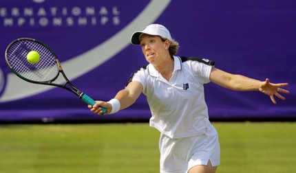 EAS08 - 20010623 - EASTBOURNE, UNITED KINGDOM : Lisa Raymond, of the USA, reaches for a shot during the doubles final at The Brittanic Asset Management Tennis Championships at Devonshire Park in Eastbourne Saturday 23 June 2001. Top-seeded Raymond and partner Rennae Stubbs defeated Cara Black and Elena Likhovtseva 6-2, 6-2. EPA PHOTO/EPA/ADRIAN DENNIS/ad/rc