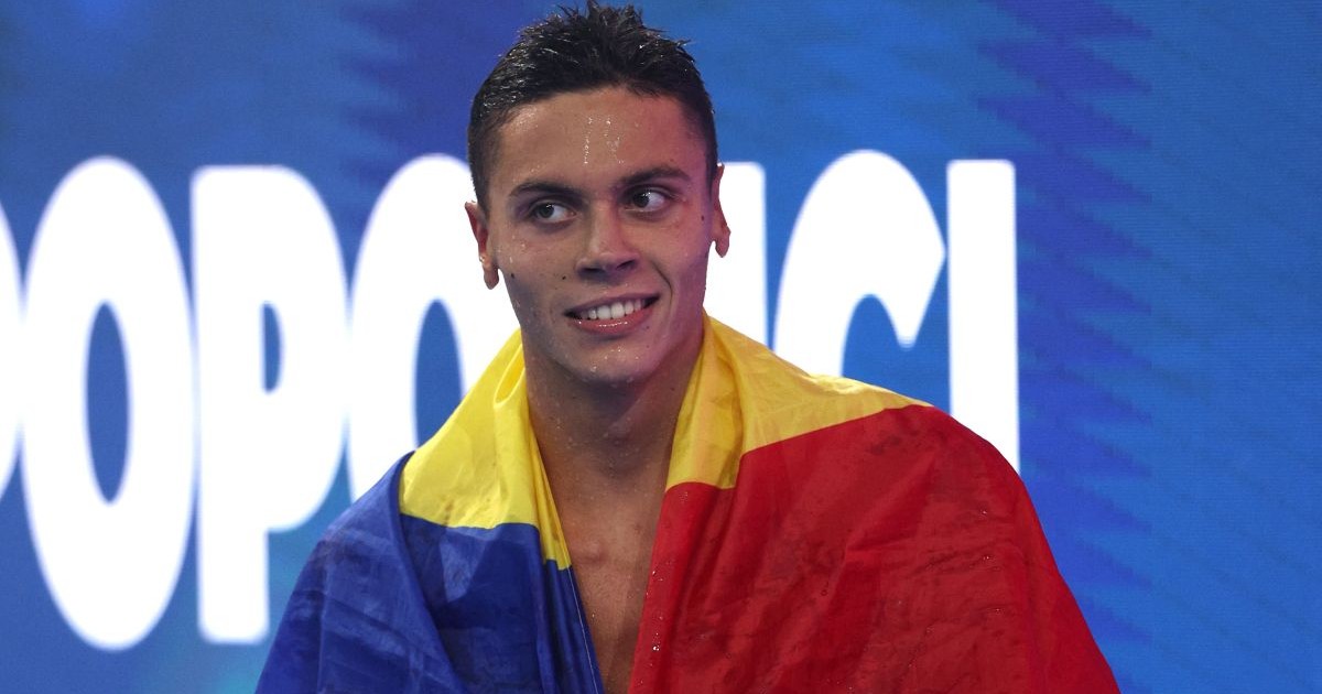 SINGAPORE, SINGAPORE - JULY 31: David Popovici of Team Romania reacts after winning the gold medal in the Men's 100m Freestyle Final on day 21 of the Singapore 2025 World Aquatics Championships at World Aquatics Championships Arena on July 31, 2025 in Singapore. (Photo by Adam Pretty/Getty Images)