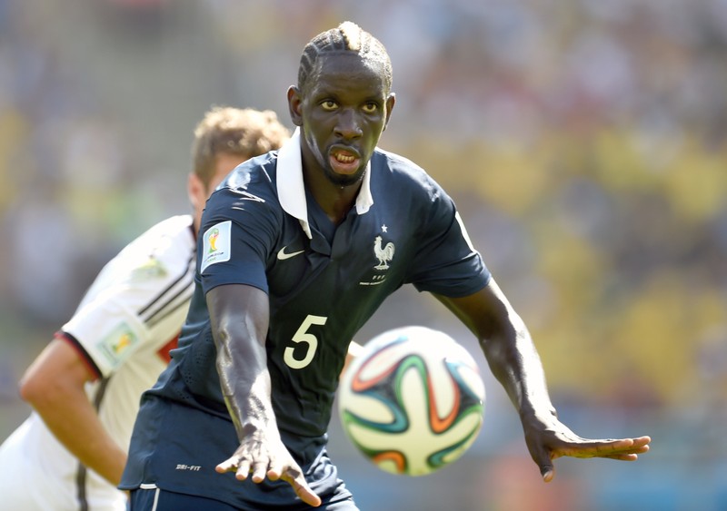 Mamadou Sakho of France and Thomas Mueller (rear) of Germany vie for the ball during the FIFA World Cup