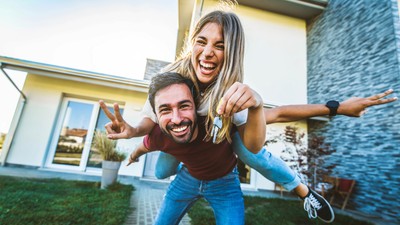 Happy,Young,Couple,Holding,Home,Keys,After,Buying,Real,Estate