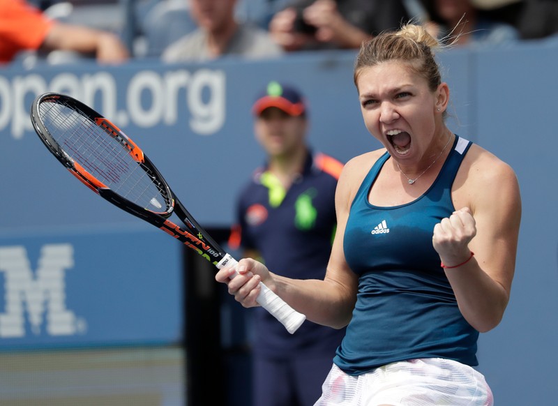 epa05525773 Simona Halep of Romania reacts after defeating Carla Suarez Navarro of Spain on the eighth day of the US Open Tennis Championships at the USTA National Tennis Center in Flushing Meadows, New York, USA, 05 September 2016. The US Open runs through September 11. EPA/PETER FOLEY