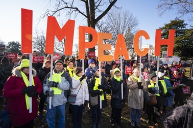 epaselect epa08079469 Activists gather at a 'Impeach and Remove' rally to show support for the Congressional impeachment of US President Donald Trump outside the Capitol in Washington, DC, USA, 18 December 2019. Later in the day, Donald Trump will likely become the third president in US History to be impeached by Congress. The House will then send the articles of impeachment to the Senate, where a trial is expected early in 2020. EPA-EFE/JIM LO SCALZO