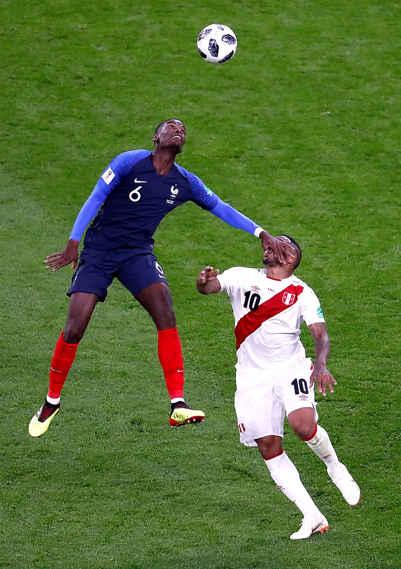 epa06828364 Paul Pogba of France (L) and Jefferson Farfan of Peru in action during the FIFA World Cup 2018 group C preliminary round soccer match between France and Peru in Ekaterinburg, Russia, 21 June 2018. (RESTRICTIONS APPLY: Editorial Use Only, not used in association with any commercial entity - Images must not be used in any form of alert service or push service of any kind including via mobile alert services, downloads to mobile devices or MMS messaging - Images must appear as still images and must not emulate match action video footage - No alteration is made to, and no text or image is superimposed over, any published image which: (a) intentionally obscures or removes a sponsor identification image; or (b) adds or overlays the commercial identification of any third party which is not officially associated with the FIFA World Cup) EPA-EFE/ROMAN PILIPEY EDITORIAL USE ONLY