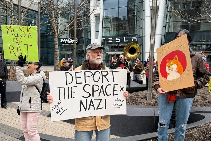 Protesters rally outside of a Tesla store in Boston, Saturday, March 1, 2025, against the company's CEO, Elon Musk, who is leading an effort to cut government jobs on behalf of President Donald Trump.,Image: 970750936, License: Rights-managed, Restrictions: This content is intended for editorial use only. For other uses, additional clearances may be required., Model Release: no, Pictured: Donald Trump,Elon Musk