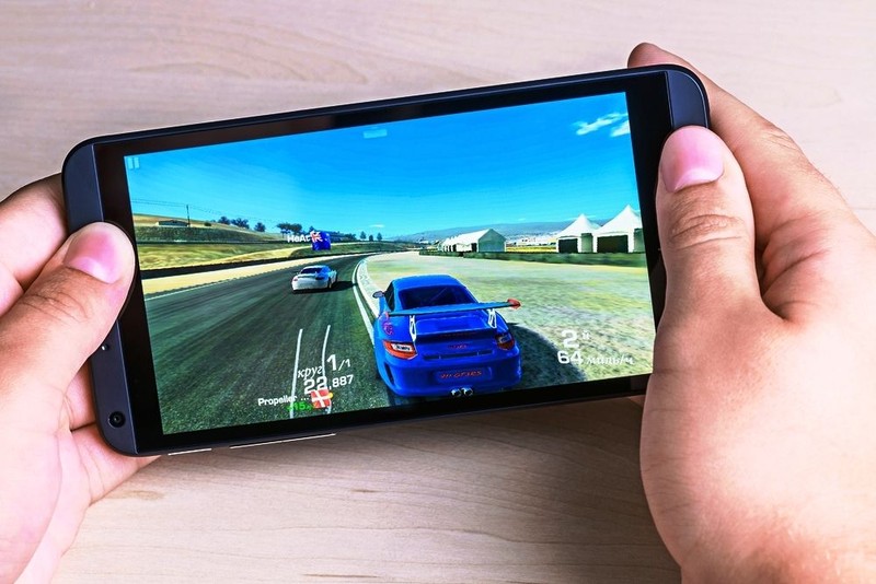 Moscow, Russia - August 26, 2014: Real Racing 3 game for android on your smartphone htc. Real Racing 3 game for mobile devices in the genre of road racing simulator.