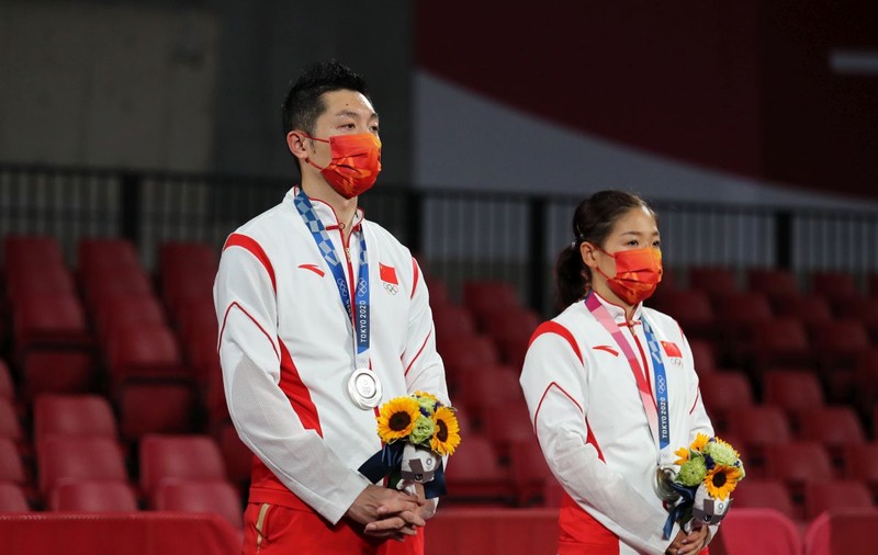 În era naționalismului chinez, sportivii care nu iau aurul olimpic devin ținte ale abuzurilor online din partea cetățenilor furioși