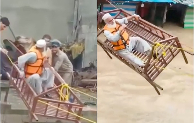 Sinistrați salvați cu patul din casele inundate, în Pakistan. O treime din țară e sub ape