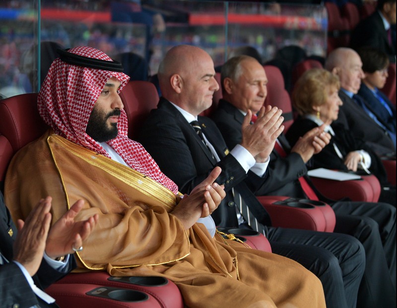 epa06807791 Saudi Arabia's Crown Prince Mohammad bin Salman (L), FIFA president Gianni Infantino (2-L) and Russian President Vladimir Putin (3-L) attend the opening ceremony before the FIFA World Cup 2018 group A preliminary round soccer match between Russia and Saudi Arabia in Moscow, Russia, 14 June 2018. (RESTRICTIONS APPLY: Editorial Use Only, not used in association with any commercial entity - Images must not be used in any form of alert service or push service of any kind including via mobile alert services, downloads to mobile devices or MMS messaging - Images must appear as still images and must not emulate match action video footage - No alteration is made to, and no text or image is superimposed over, any published image which: (a) intentionally obscures or removes a sponsor identification image; or (b) adds or overlays the commercial identification of any third party which is not officially associated with the FIFA World Cup) EPA-EFE/ALEXEI DRUZHININ / SPUTNIK / KREMLIN POOL MANDATORY CREDIT EDITORIAL USE ONLY