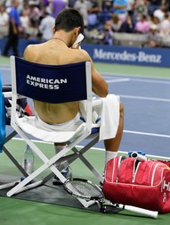 epa05535690 Novak Djokovic of Serbia reacts during a changeover as he plays Stan Wawrinka of Switzerland during the men's final on the final day of the US Open Tennis Championships at the USTA National Tennis Center in Flushing Meadows, New York, USA, 11 September 2016. The US Open runs through September 11. EPA/DANIEL MURPHY