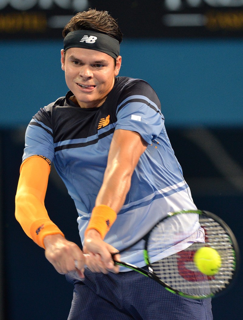 epa05094968 Milos Raonic of Canada returns a ball to Roger Federer of Switzerland during the Men's Final of the Brisbane International Tennis Tournament in Brisbane, Australia, 10 January 2016. EPA/BRADLEY KANARIS AUSTRALIA AND NEW ZEALAND OUT