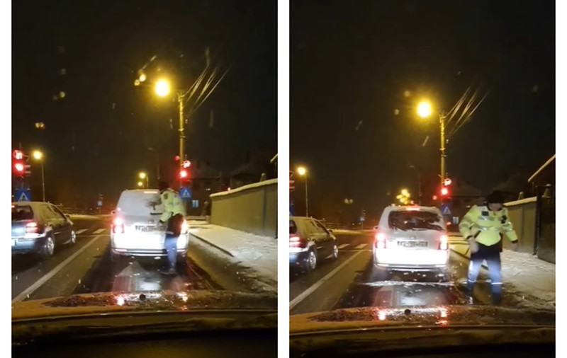 VIDEO | Un poliţist s-a dat jos din autospecială pentru a-i curăța  luneta de zăpadă şoferului din faţa lui