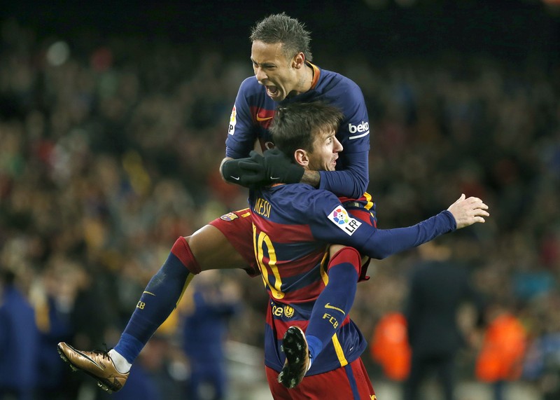 epa05090564 FC Barcelona's Argentinian striker Leo Messi (down) jubilates his second goal with Brazilian striker Neymar (up) against RCD Espanyol during their their Spanish King's Cup first leg match round of 16th played at Camp Nou stadium in Barcelona, Catalonia, Spain on 25 January 2016. EPA/ANDREU DALMAU