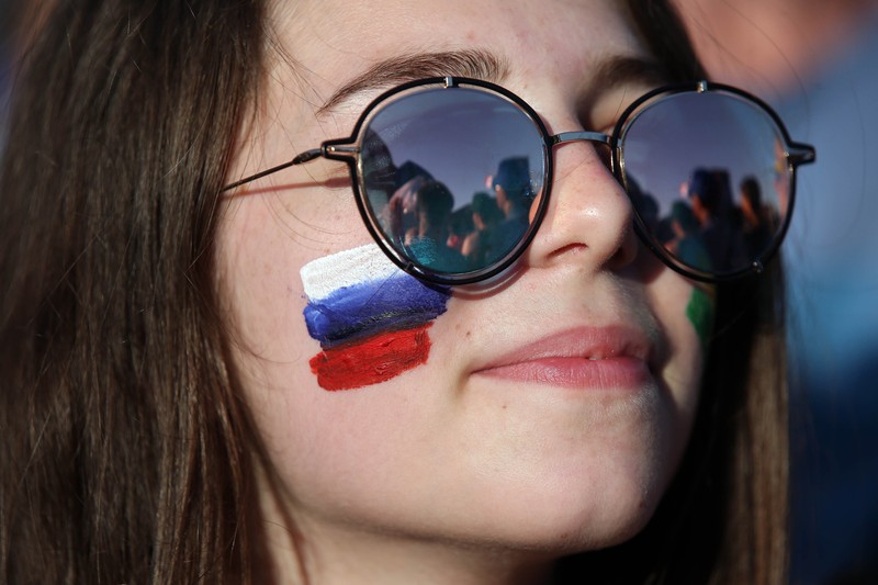 epa06807559 A Russia's fan cheer for her team during a live broadcast of the FIFA World Cup 2018 Group A preliminary round soccer match between Russia and Saudi Arabia in the fan zone in Sochi, Russia, 14 June 2018. The FIFA World Cup 2018 will take place in Russia from 14 June until 15 July 2018. EPA-EFE/MOHAMED MESSARA