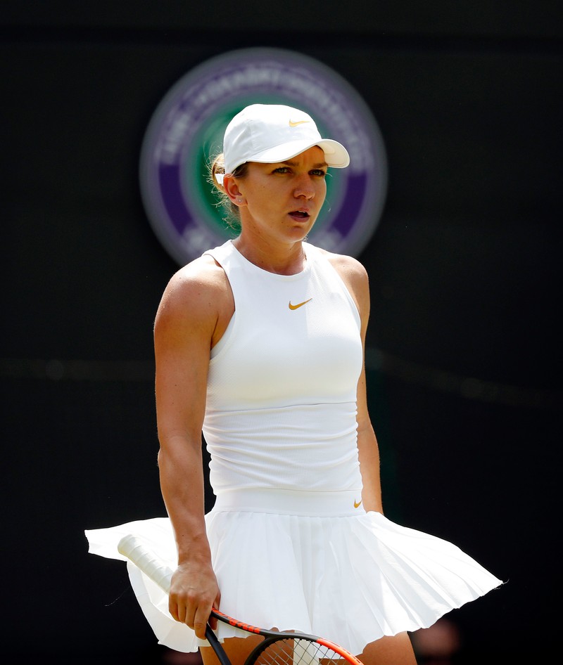 epa06870785 Simona Halep of Romania plays Su-Wei Hsieh of Taiwan in their third round match during the Wimbledon Championships at the All England Lawn Tennis Club, in London, Britain, 07 July 2018. EPA-EFE/NIC BOTHMA EDITORIAL USE ONLY/NO COMMERCIAL SALES