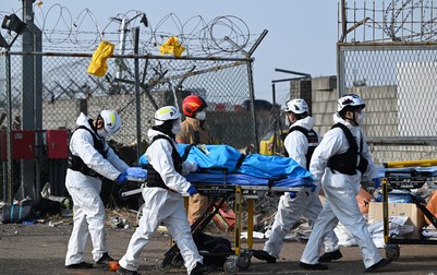 SEOUL, Dec. 29, 2024 -- Rescuers operate at the site of an airplane crash at the Muan International Airport, some 290 km southwest of Seoul, South Korea, Dec. 29, 2024. Most of the people aboard a South Korean airplane that crashed at an airport in southwest South Korea on Sunday morning were believed to have been killed except two rescued, local fire authorities said. The passenger plane with 175 passengers, including 173 South Koreans and two Thais, as well as six flight attendants on board, crashed while attempting to land at the Muan International Airport, some 290 km southwest of the capital Seoul, at about 9:07 a.m. local time (0007 GMT).,Image: 950672890, License: Rights-managed, Restrictions: , Model Release: no
