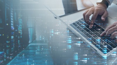 Computer,Engineer,Working,On,Laptop,Computer,With,Server,Room,,Data