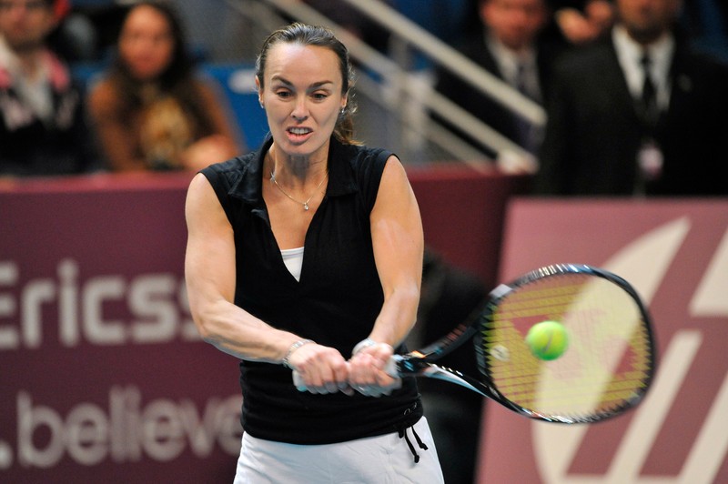 epa03102731 Martina Hingis from Switzerland in action during the legends exhibition match at the WTA GDF Suez Tennis Open 2012 in Paris, France, 12 February 2012. Martina Hingis from Switzerland and US Martina Navratilova played a doubles match against France's Amelie Mauresmo and US Monica Seles. EPA/STEPHANE REIX