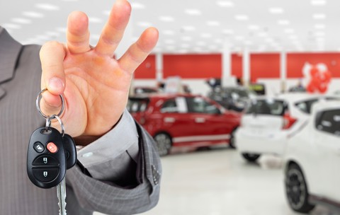 Hand,With,A,Car,Key.,Auto,Dealership,And,Rental,Concept