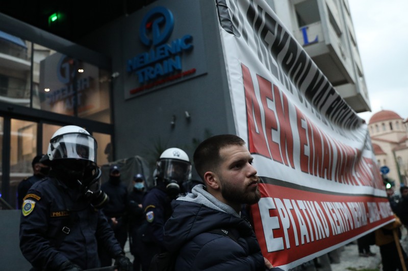 epa10499330 People take part in a protest march outside of the Hellenic Train headquarters in Athens, 02 March 2023, following the deadly train crash in Larissa, Greece. The death toll of the train collision that occurred on the Athens-Thessaloniki line has risen to 57, Hellenic Police spokesperson confirmed 02 March evening, while 48 people are still in hospital. The collision occurred late on Tuesday 28 February night near Tempi in central Greece between a passenger train travelling north and a freight train travelling south on the same line. A station master in the central Greek city of Larissa has been detained over the accident. EPA-EFE/GEORGE VITSARAS