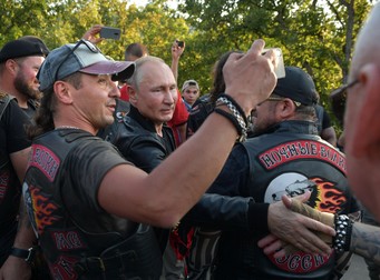 epa07768210 Russian President Vladimir Putin (C) poses for a photo with members motorbike club Night Wolves at the Babylon's Shadow bike show in Sevastopol, Crimea, 10 August 2019 (issued 11 August 2019). Putin and the Night Wolves bikers took part in an annual show organised by the motorcycle club in the Black Sea peninsula, annexed by Russia from Ukraine in March 2014, while tens of thousands of people on 10 August protested against Putin's government following local election violations. EPA-EFE/ALEXEI DRUZHININ / SPUTNIK / KREMLIN POOL / POOL