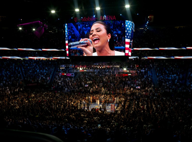 epa06165759 US singer Demi Lovato (on screen) performs at the T-Mobile Arena prior the fight between US boxer Floyd Mayweather and Irish boxer Conor McGregor in Las Vegas, Nevada, USA, 26 August 2017. EPA-EFE/ARMANDO ARORIZO
