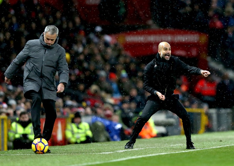 epa06381913 Manchester United's manager Jose Mourinho (L) and Manchester City's manager Pep Guardiola (R) during the English premier league soccer match between Manchester united and Manchester City at Old Trafford Stadium in Manchester, Britain, 10 December 2017. EPA-EFE/Nigel Roddis EDITORIAL USE ONLY. No use with unauthorized audio, video, data, fixture lists, club/league logos or 'live' services. Online in-match use limited to 75 images, no video emulation. No use in betting, games or single club/league/player publications